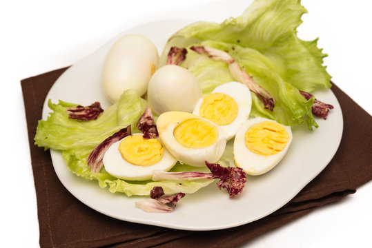 Hard Boiled Eggs with fresh vegetable garnish 