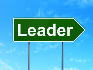 Business concept: Leader on road sign background