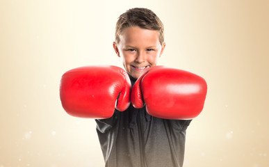 Kid with boxing gloves