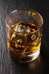 Glass of scotch whiskey with ice