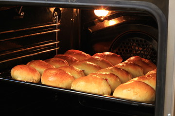 Homemade cakes with jam are baked in the oven