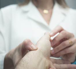 Traumatologist orthopedic surgeon doctor examining patient