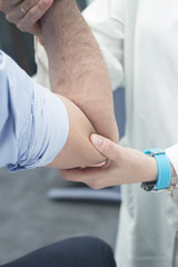 Traumatologist orthopedic surgeon doctor examining patient