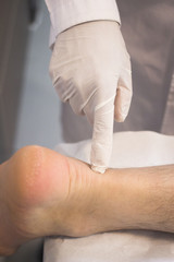 Traumatologist orthopedic surgeon doctor examining patient