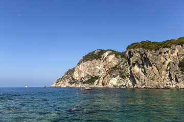 Fototapeta na wymiar Ionian seashore with blue water and sky