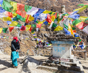 Buddhist stone stupa prayer mani mantra flags, Nepal.