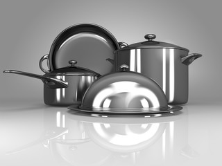 stainless steel kitchenware on gray background
