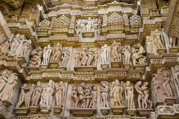 Stone carved erotic bas relief in Hindu temple in Khajuraho, India. Unesco World Heritage Site