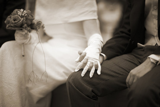Hands of bride and bridegroom in wedding marriage ceremony