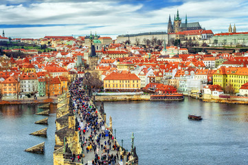 Naklejka premium Panorama of Prague with the Castle, Charles Bridge, Vltava river