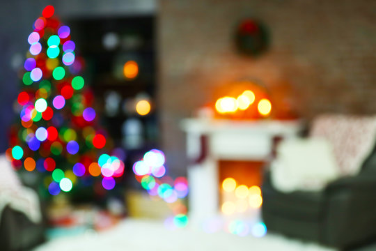 Holiday decorated room with Christmas tree, out of focus shot for photo background