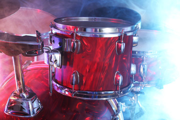 Fototapeta na wymiar Drum set in smoke on a stage