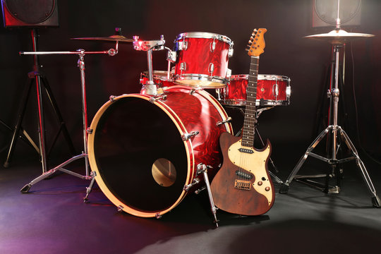 Musical instruments on a stage on dark background