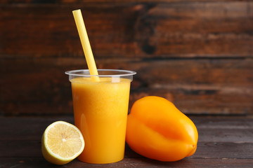 Fresh vegetable juice on wooden background