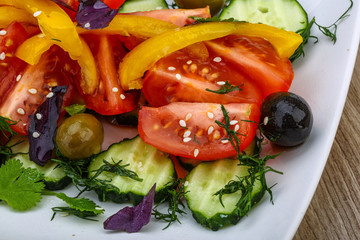 Salad with tomato, cucumber and olives