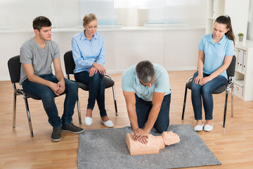 Fototapeta na wymiar Instructor Teaching First Aid Cpr Technique