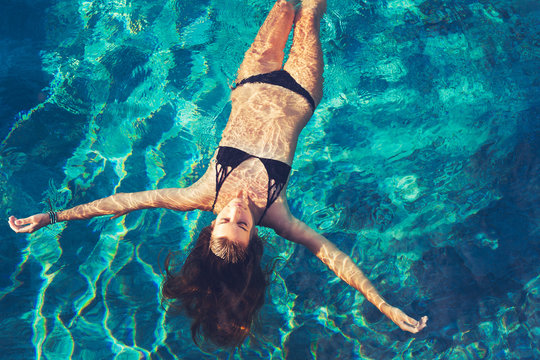 Woman Floating in Water Relaxing