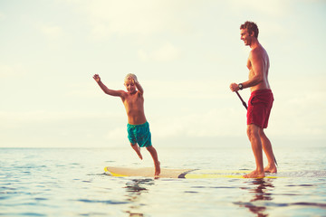 Father and Son Stand Up Paddling