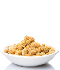 Dried white mulberry in white bowl over white background