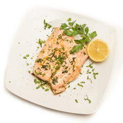 Poached salmon with extra virgin olive oil and parsley 