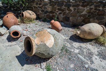 old Kvevri earthenware vessels for wine in ancient rock-hewn town called Uplistsikhe in Georgia