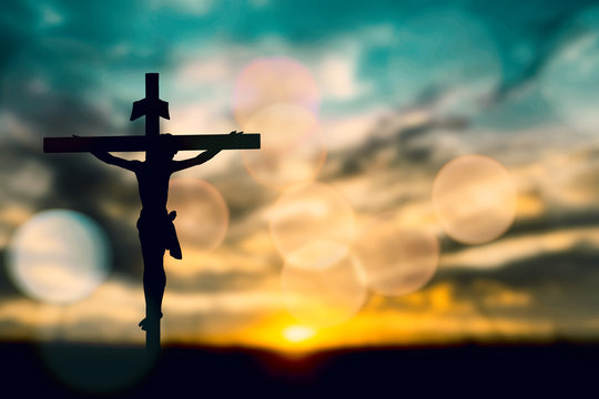 Silhouette of Jesus with Cross over rainbow sunset concept for religion, worship, Christmas, Good Friday, Easter, Jesus he is risen, Thanksgiving prayer and praise, promise