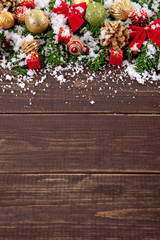 Fototapeta na wymiar Christmas decoration border on wood background with copyspace