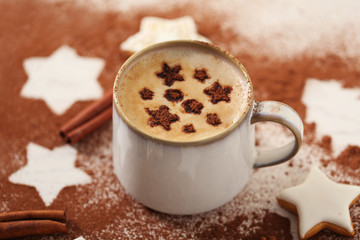 Beautiful composition with cup of cappuccino and Christmas cookies