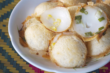 Thai sweetmeat/Knmcrk, Kind of Thai sweetmeat, made from coconut milk with sugar and flour.