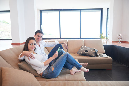 couple at modern home using tablet computer