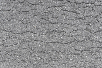 Sidewalk asphalt road with cracks