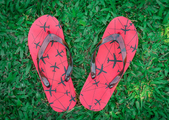 Flipflops with airplanes on the soles.