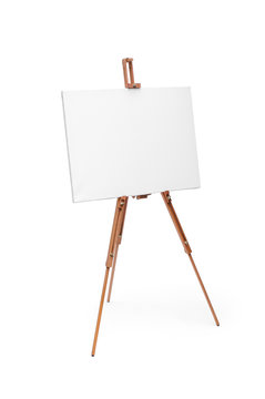 White painter canvas on wooden easel isolated on white with clip