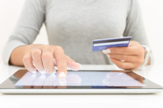 woman using tablet and credit card pay shopping online