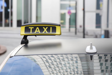 taxi sign on roof top car