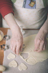 woman making ginger bread cookies in the kitchen