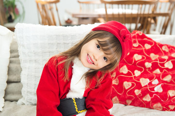 Cute little girl in Santa Claus costume