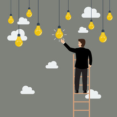 Businessman on the ladder catching a light bulb idea © siraanamwong