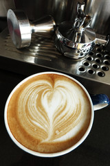 a cup of latte art coffee.