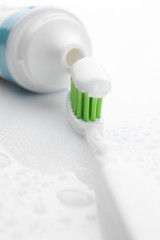 Fototapeta na wymiar Toothbrush with toothpaste close-up