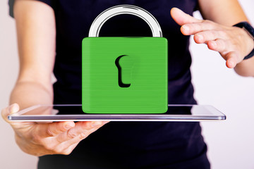 Hand holding tablet pc with padlock