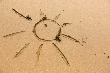 Sun drawn in the sand.
