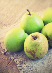 Pears on a rustic wooden kitchen table