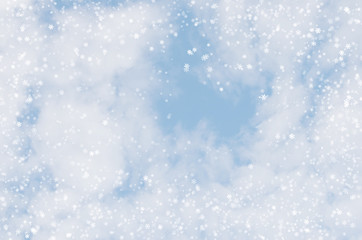 Falling snowflakes on  blue background