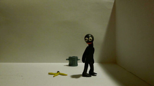 Plasticine man cleaning the territory around, but finally loses his patience