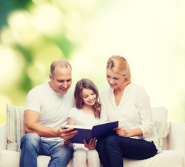 Fototapeta premium happy family with book at home