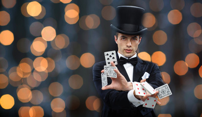 magician showing trick with playing cards