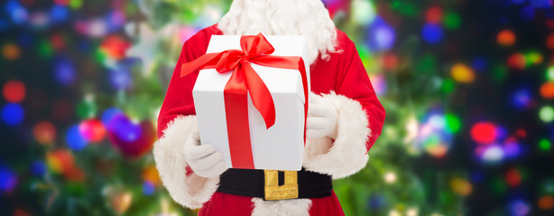 man in costume of santa claus with gift box