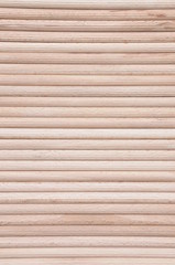 Wooden stakes in rows as background