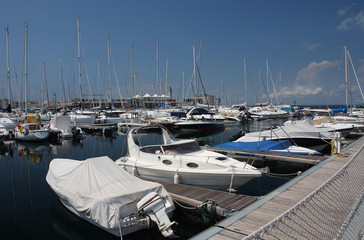 Fototapeta premium Motor boats and sailboats in harbor in Trieste, Italy